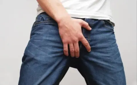 Man in jeans and a white t-shirt
