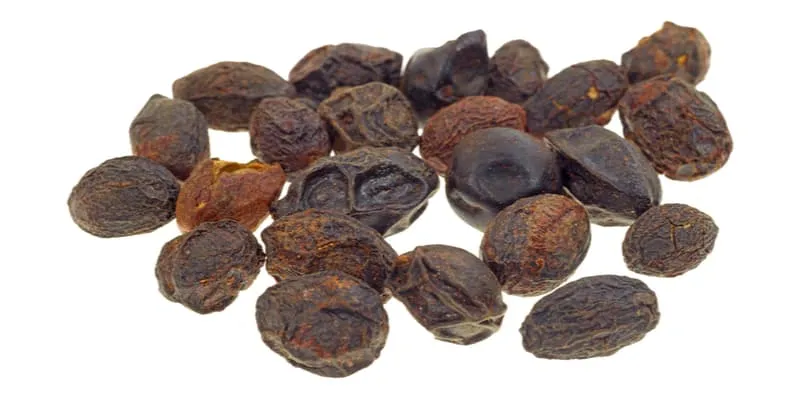 Dried saw palmetto berries, a herb often linked with enlarged prostate remedies